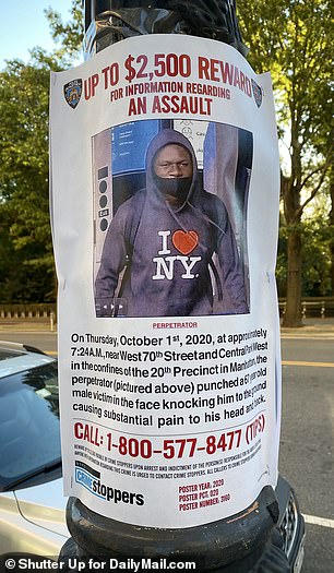 Moranis walked in a neighborhood decked out with reward posters with pictures of his attacker