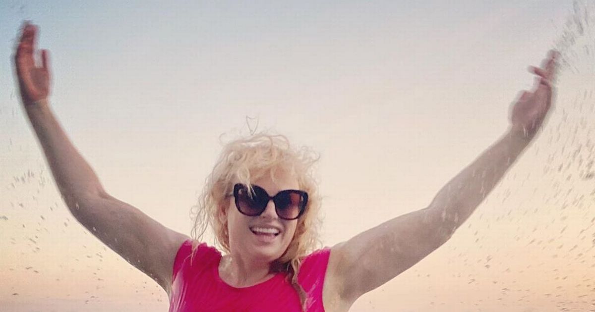 Rebel Wilson showcases incredible three stone weight loss in hot pink swimsuit