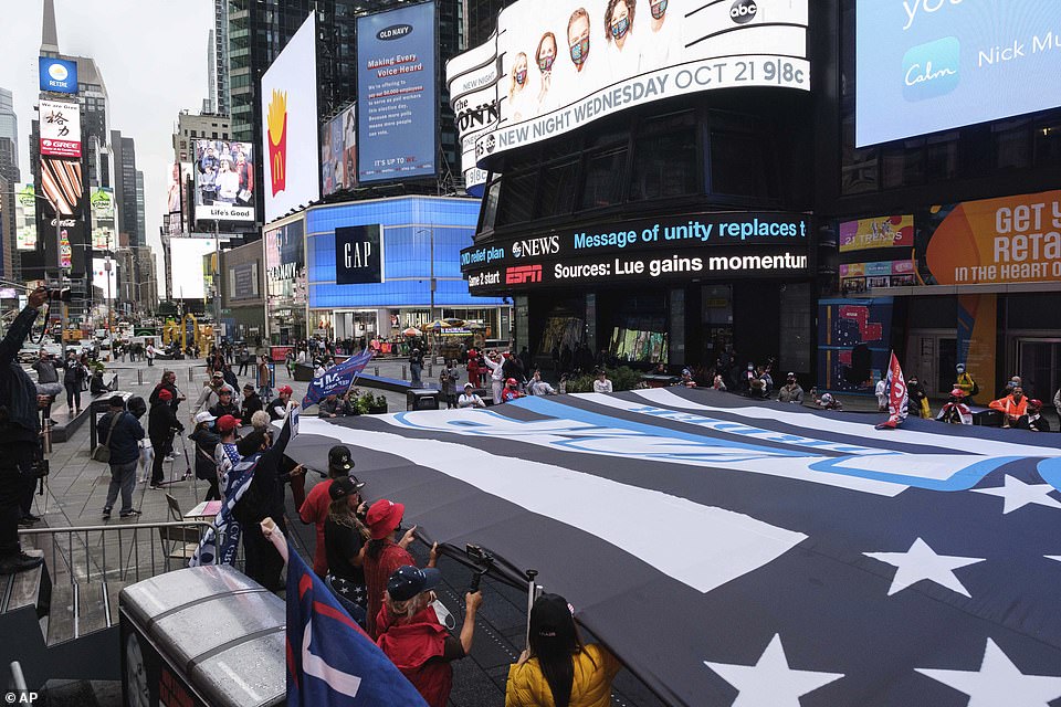 They finished the march in Times Square as they blasted Frank Sinatra's 'New York, New York'