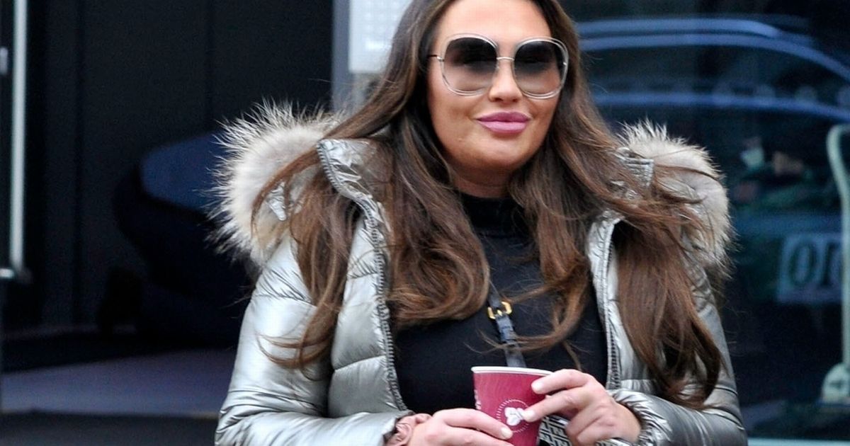 Lauren Goodger flashes cheeky smile at beauty course after Mark Wright dig