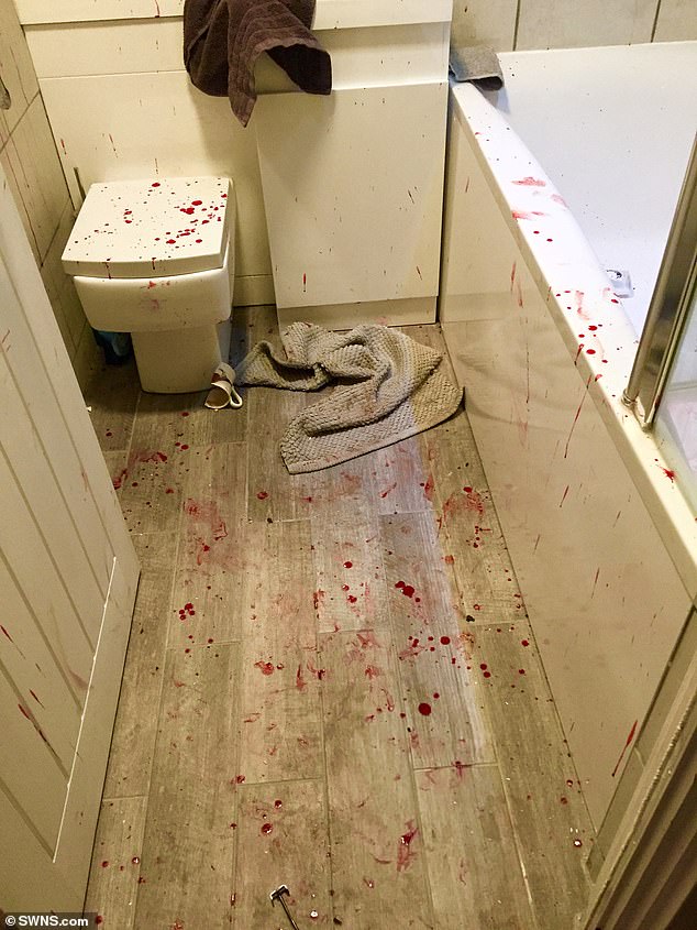 The bathroom is seen covered in blood following the a break in by four armed robbers that Pugh fought off with his bare hands