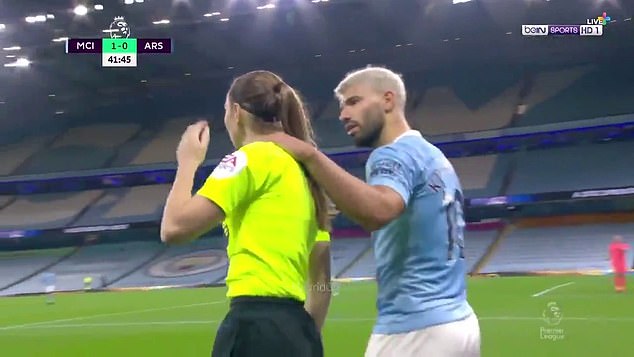 Moment Manchester City striker Sergio Aguero grabs assistant referee Sian Massey-Ellis around neck