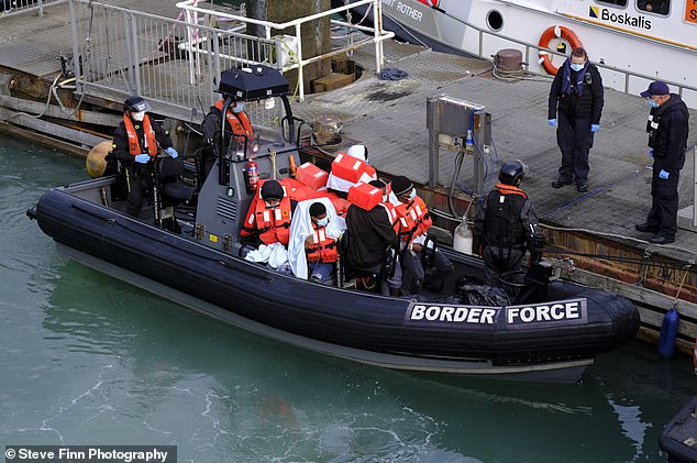 Unconfirmed reports say around 60 were brought into the Port of Dover in Kent during the morning after they were intercepted by a Border Force cutter in a number of small boats in the English Channel