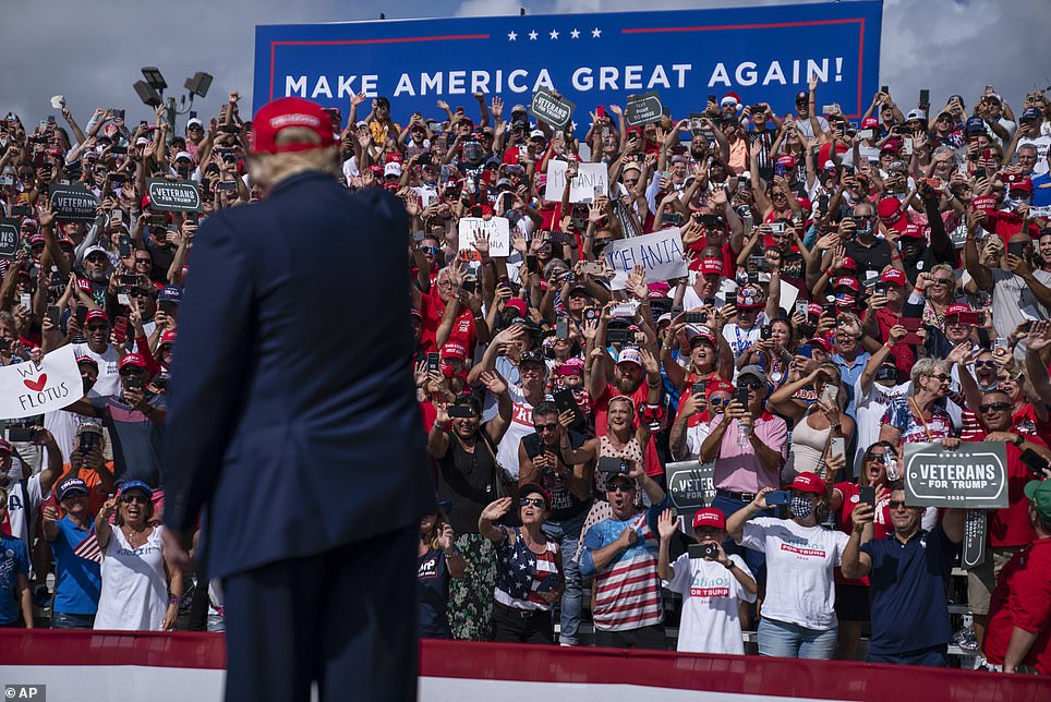 Trump's view: The stands were packed in Tampa, Florida with fans waving signs and flashing thumbs up signs to the president. Trump has ignored implementing coronavirus precautions at his rallies, despite catching the virus himself this month