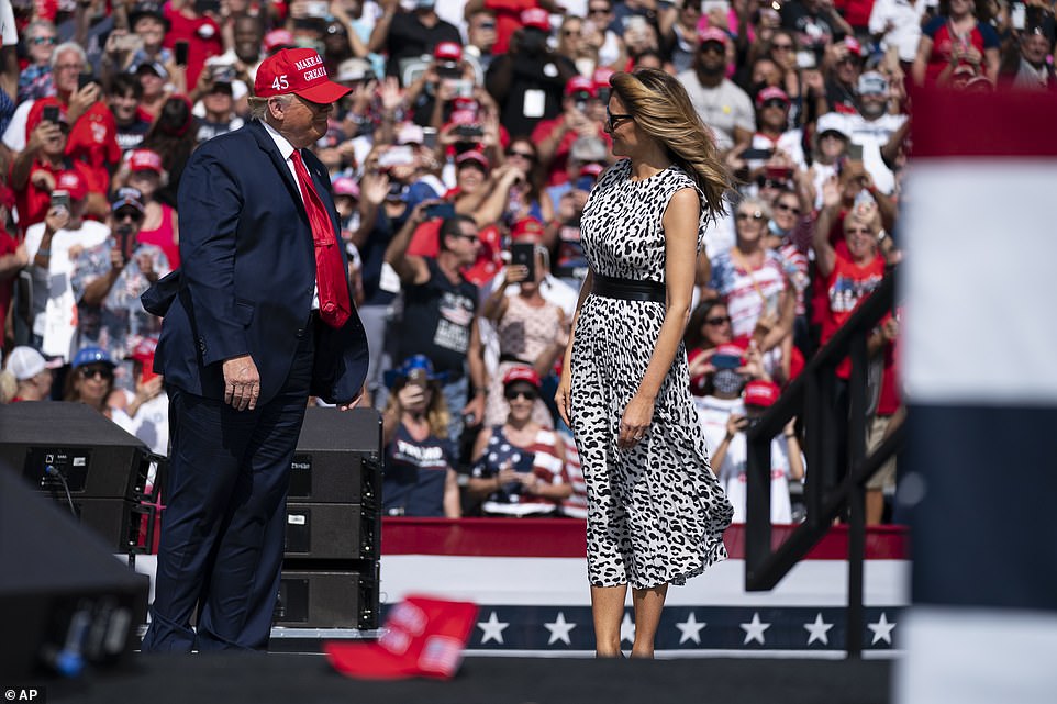 Trump and Melania shared a smile on stage before he shared his speech before a packed crowd