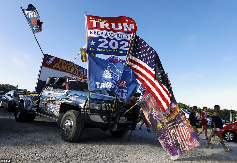 Trump fans came out in full force in Tampa. This supporter painted his car to say 'Patriots 4 Trump' and held a slew of MAGA flags.