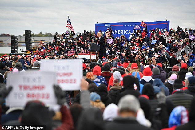 Not a lot of masks: As has become customary at Trump rallies, there was no social distancing and - with the exception of some of those directly behind him and Laura Ingraham - little sign of mask wearing