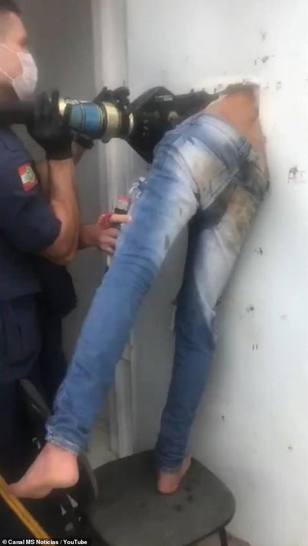 Brazilian firemen drill hole through jail cell door to rescue teen who tried to escape