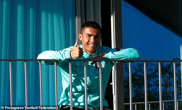Cristiano Ronaldo watches Portugal team-mates from balcony after testing positive for coronavirus