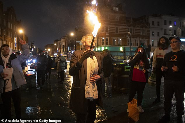 Fire-breathing Piers Corbyn leads demonstrators in ‘street-party’ protest against Covid lockdown