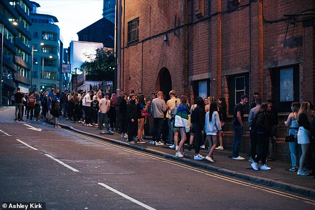 Freshers ignore social distancing as they cram on pavement outside club