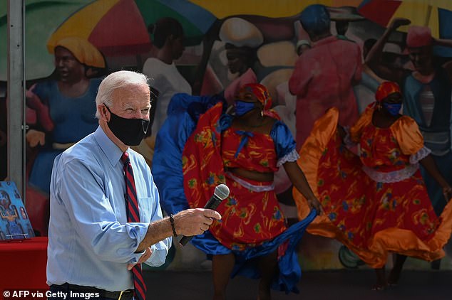 Joe Biden watches a traditional Haitian dance at the Little Haiti Cultural Complex in Miami on Florida, where he raised eyebrows with a remark to young dancers