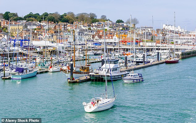 Marina with boats on the Solent at East Cowes, Isle of Wight. Migrants who land in Britain could be flown to hostels on the island