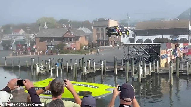 Stuntman Travis Pastrana jumps a rally car over a waterway in his hometown