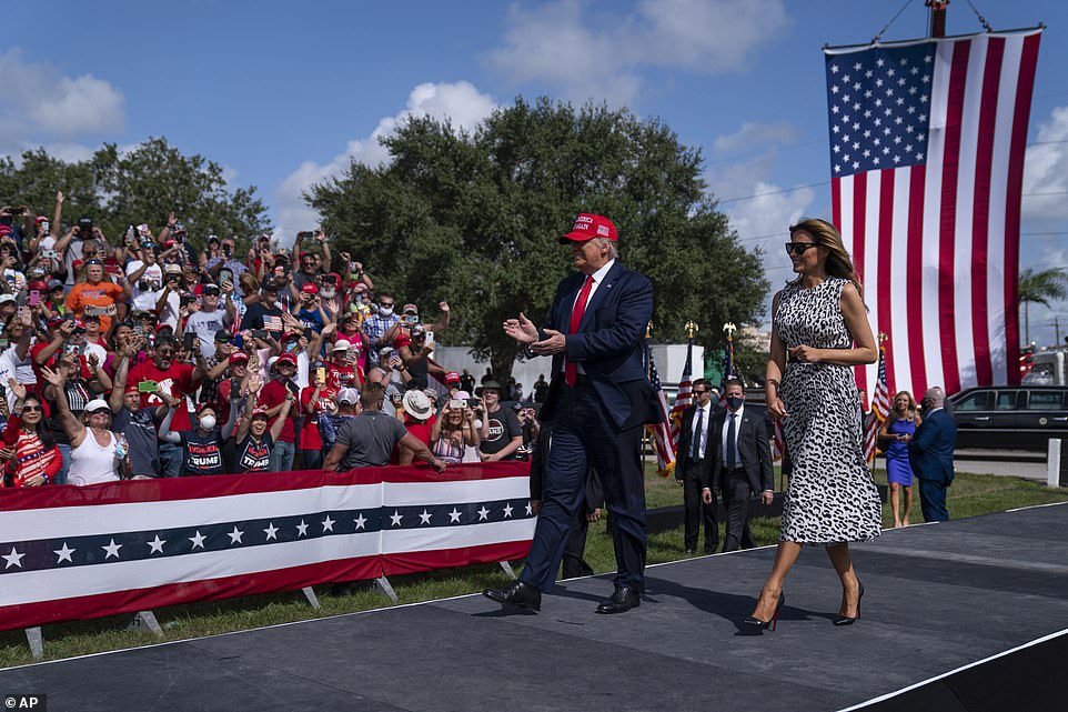 President Donald Trump and Joe Biden are hosting dueling campaign rallies in Florida today in the home stretch to Election Day and the contrast couldn’t be more stark as MAGA fans flout masks and social distancing in packed stands while Biden’s supporters spread out and cheer from their cars. Trump and First Lady Melania arriving at the Raymond James Stadium in Tampa, Florida on Thursday