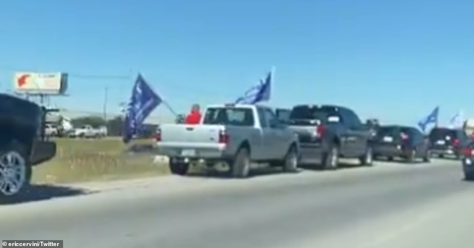 At least 50 vehicles waving MAGA flags were seen on the shoulder of Interstate 35 in Hays County on Friday afternoon