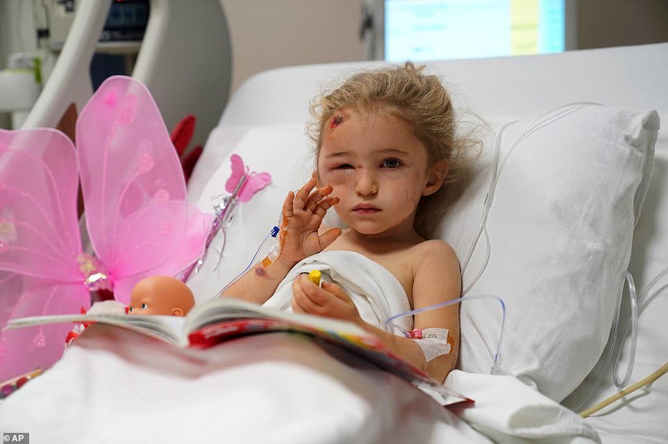 Three-year-old girl Elif Perincek rests in her hospital bed after she was rescued from the rubble of a building some 65 hours after a magnitude 6.6 earthquake in Izmir, Turkey, Monday