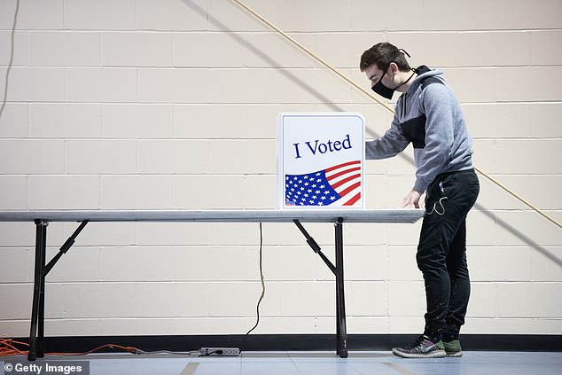 First-time voter Alex Jimenez uses a voting machine on November 3, 2020 in Columbia, South Carolina