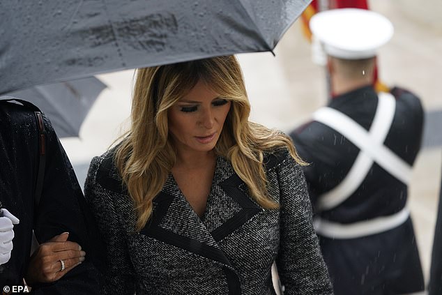 Melania was escorted by a Military member as her husband participated in the wreath laying
