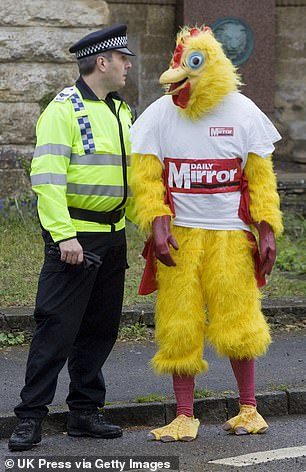 Cain dressed in a chicken costume while a reporter for the Daily Mail