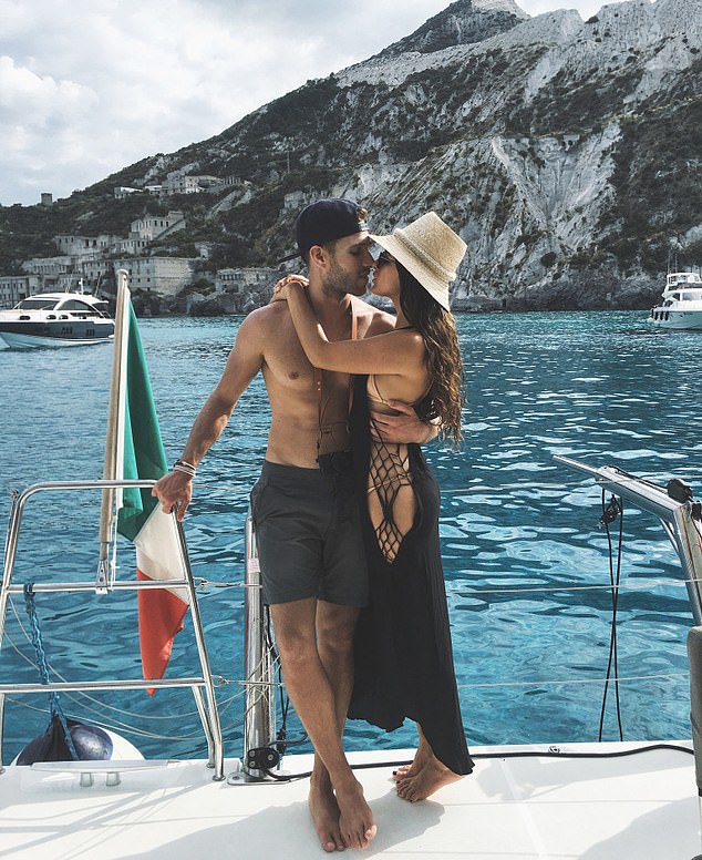 Michael Saiger and his girlfriend Rachael Russell pictured on a yacht off the Italian coast
