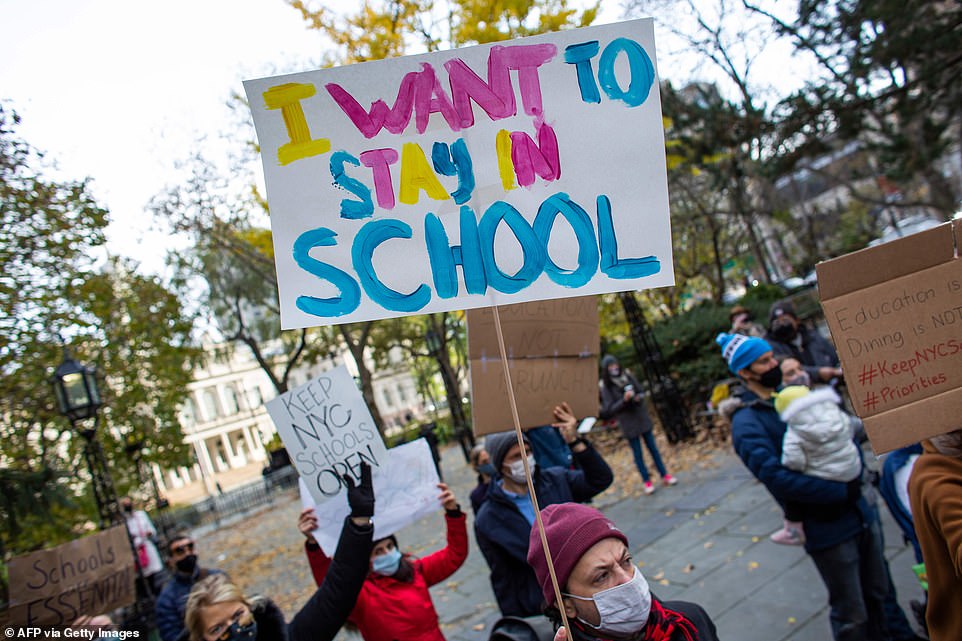 Parents protest demanding that public schools remain open, outside New York's City Hall on November 19