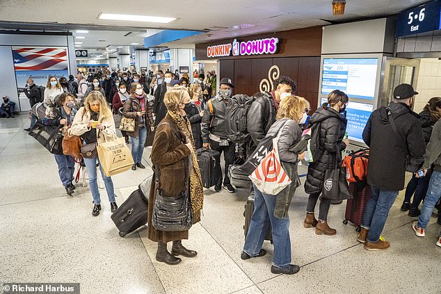 Thanksgiving travelers leaving Pen Station in New York on Wednesday