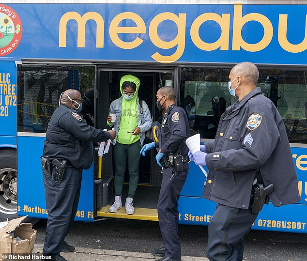 A Megabus from D.C. ends its destination in Manhattan, where passengers were met with NYC Sheriffs department asking them to fill out a contract tracing form