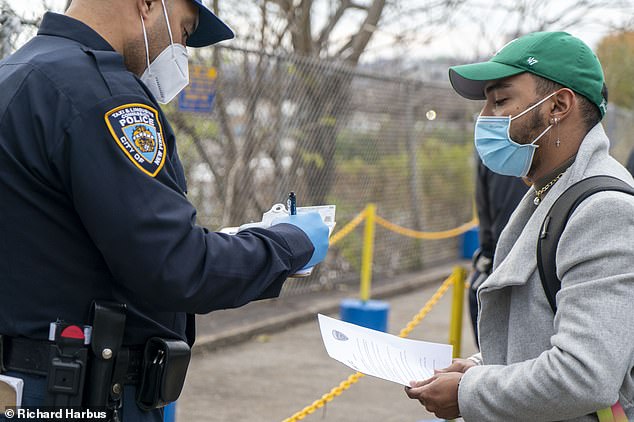 Travelers to NYC on Wednesday are stopped at Covid checkpoints and asked show ID and fill out forms detailing where they were going and put down their home address for follow up