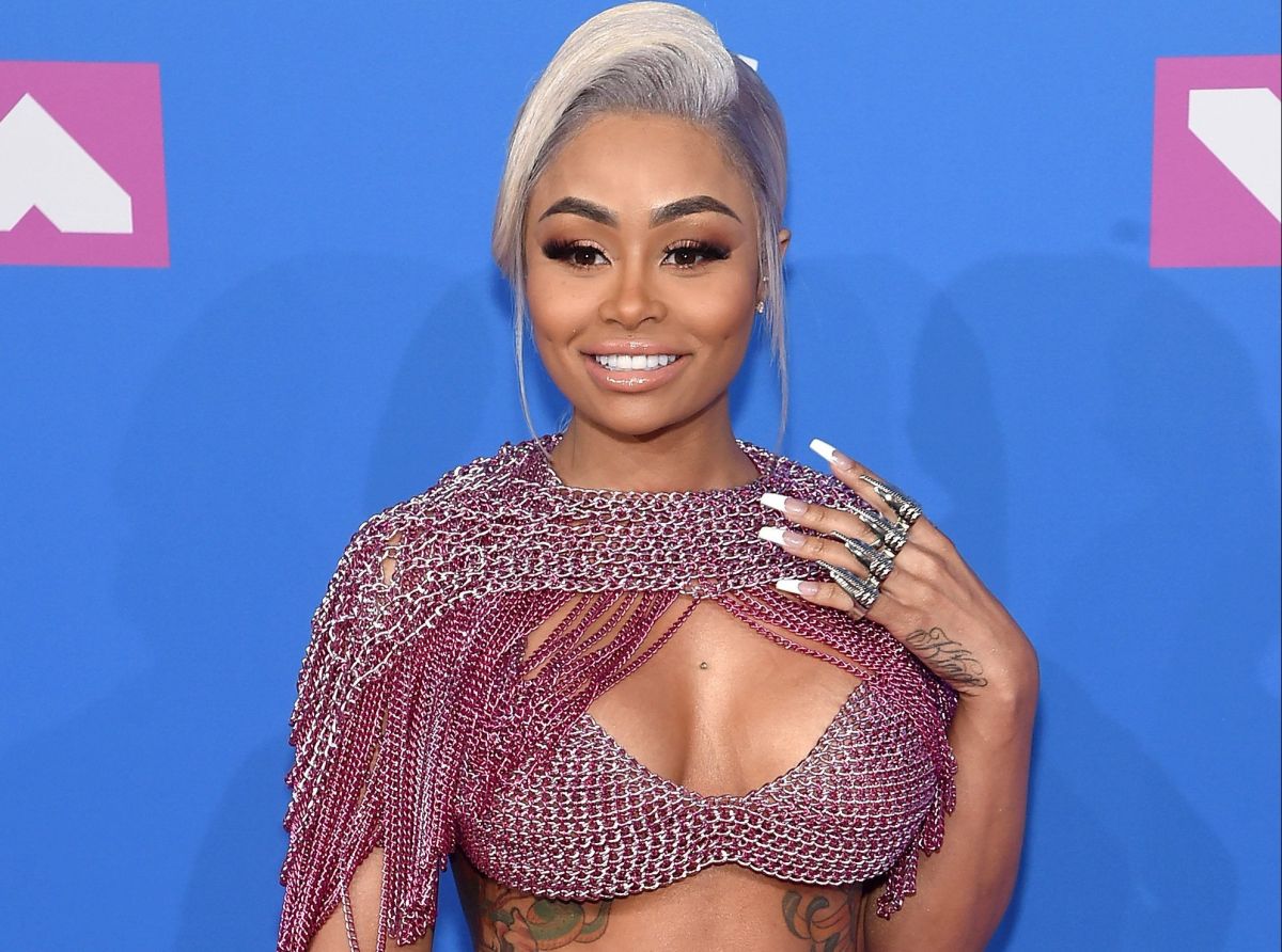 Blac Chyna shows off her prominent curves in an open shirt without a bra