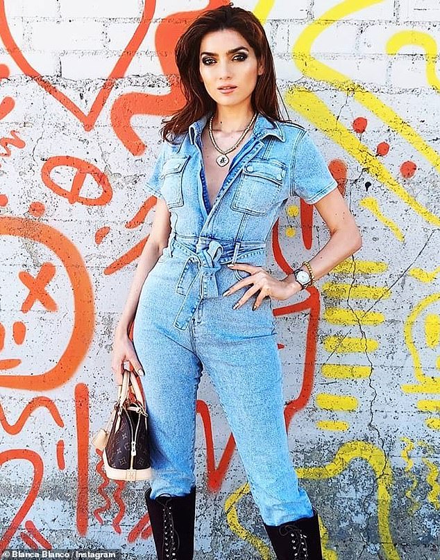 Blanca Blanco models a jumpsuit with a statement necklace