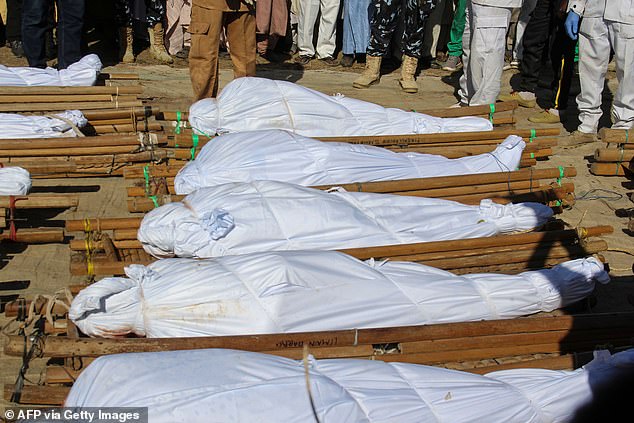 Boko Haram militants behead and slit the throats of 43 Nigerian rice farmers and fishermen