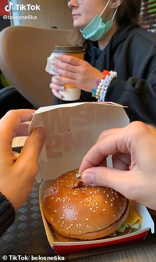 Boyfriend surprises his girlfriend by proposing with a ring hidden inside a Big Mac burger