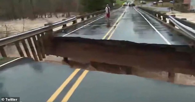 Bridge collapses just feet away from TV reporter amid flash flooding in North Carolina