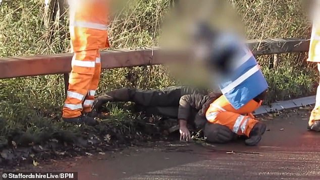 HS2 worker is filmed kneeling on the neck of a protester at the site in Fradley, Staffordshire