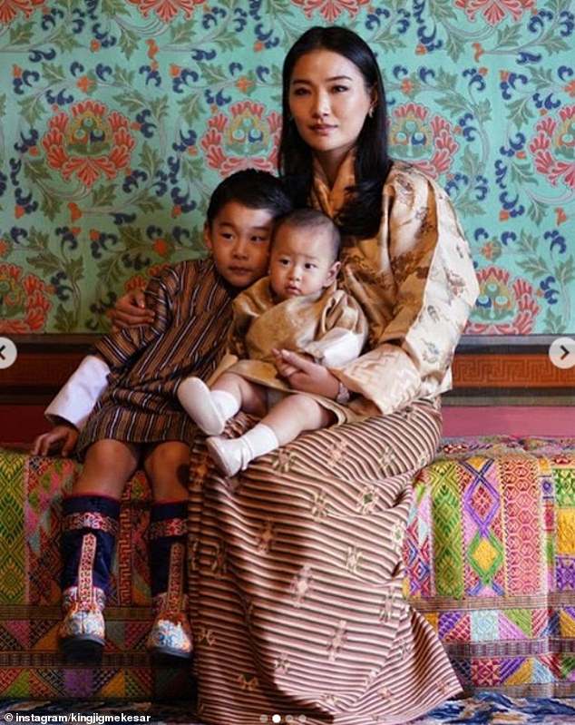 Prince Jigme Namgyel of Bhutan cuddles up with Prince Jigme Ugyen in an adorable snap