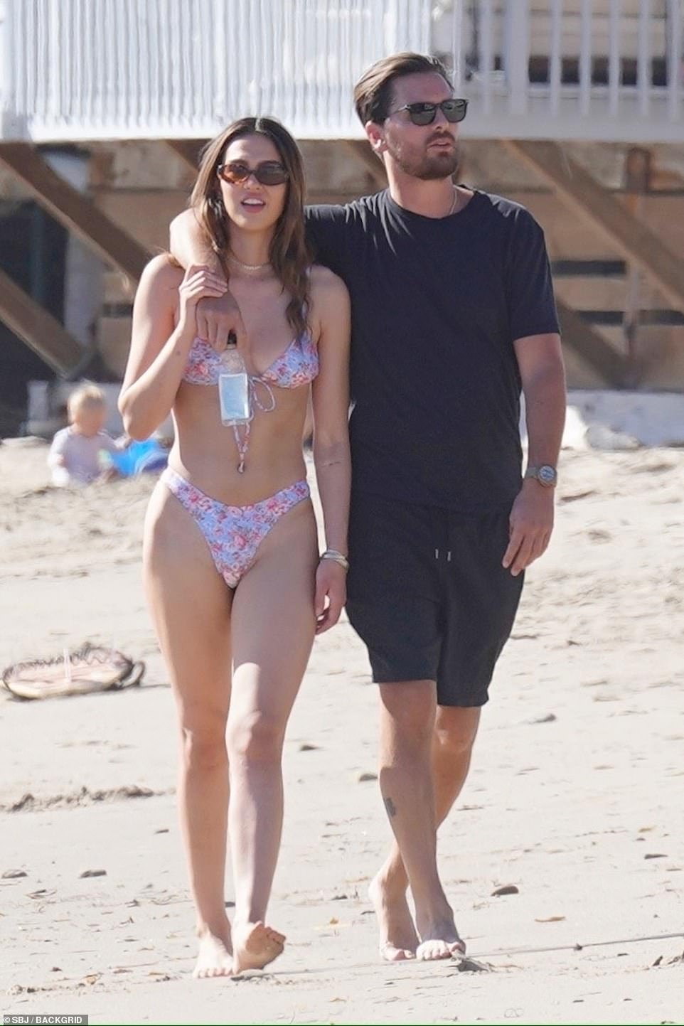 Scott Disick, 37, puts his arm around a bikini-clad Amelia Hamlin, 19, in Malibu