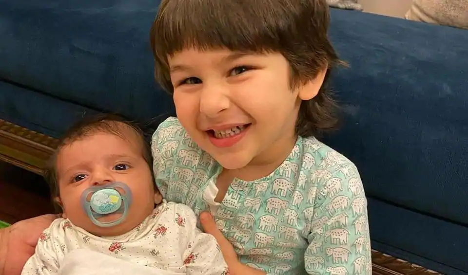 Taimur Ali Khan flashes a million-dollar smile as he poses with a baby. Fans can’t get over ‘precious’ photo