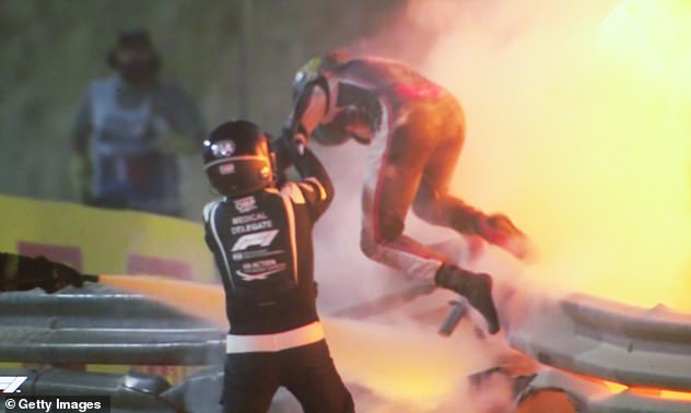 Shocking images show the moment  Grosjean managed to pull himself from the burning wreckage on Sunday after he was exposed to the flames for almost 30 seconds