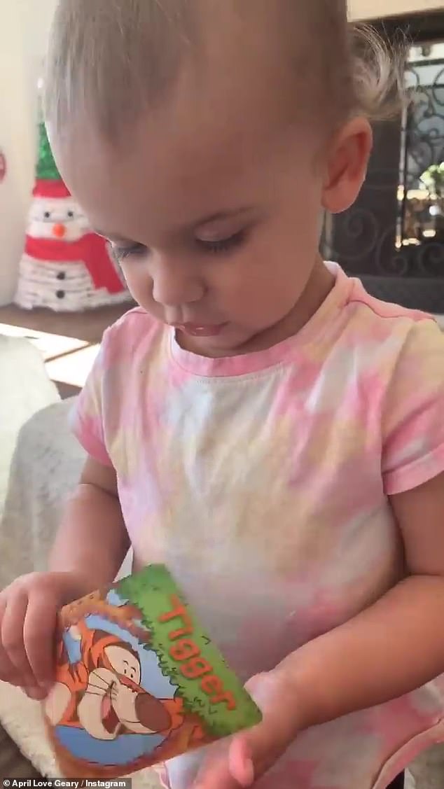 Bonding: Earlier in the day, April shared cute videos of Lola trying to play a Winnie the Pooh card game