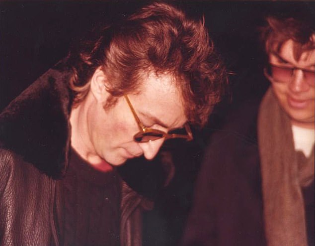 Fateful: John Lennon signs autograph for Mark Chapman hours before Chapman killed him