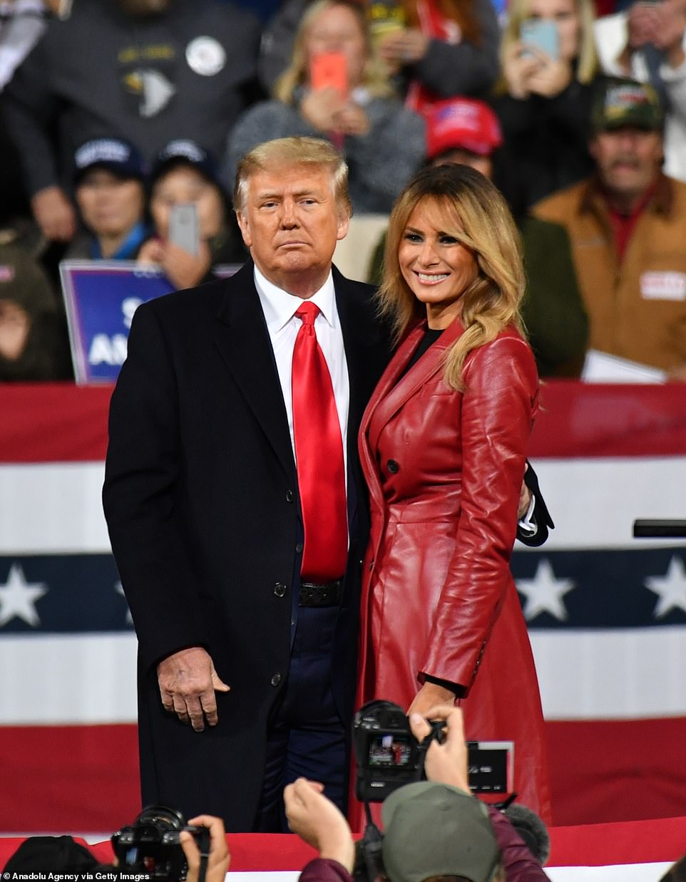 Melania Trump, 50, looked sensational in a $6,200 red leather Alexander McQueen coat as she joined the President at a campaign rally in Georgia last night