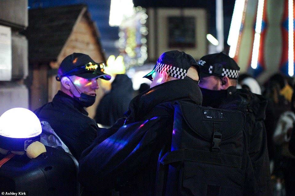 It was revealed on Saturday that Nottingham's Christmas market-goers will see armed police around the city centre as the force steps up patrols for the festive season. Pictured: Police at the market on Saturday