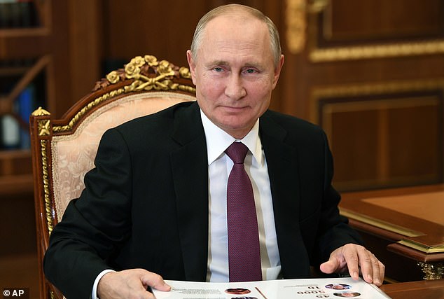 Vladimir Putin, pictured in Moscow today, keeps his private life secret and little is known about his friends or family