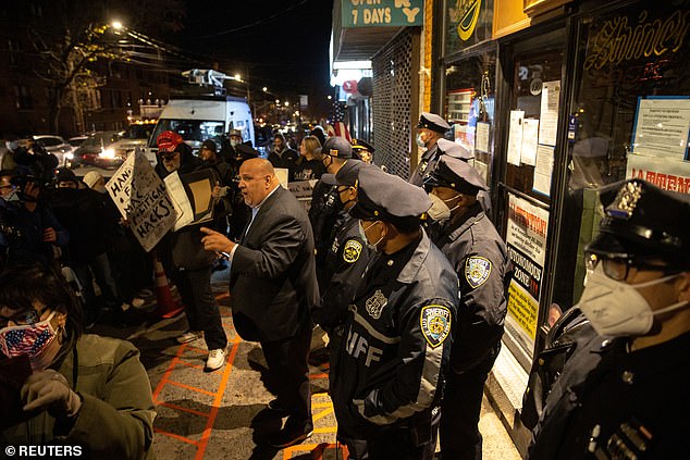 The Staten Island bar was the site of protests last week, pictured, after the sheriff's office said plainclothes officers were able to go inside and order food and beverages on Tuesday. Presti was arrested at the time