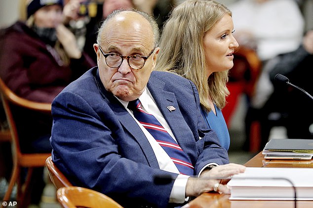 He called in to WABC Wednesday and said he was feeling 'just about 100% percent right now' after being given a cocktail of 'miracle' drugs. Giuliani said he was taking remdesivir, the steroid dexamethasone and an unidentified 'cocktail'. He is pictured with Trump lawyer Jenna Ellis. Both tested positive for coronavirus