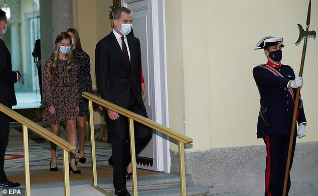 The Spanish royals put safety first in face masks as they made their way inside today. Pictured, Spain's King Felipe VI (C-right) and Leonor, Princess of Asturias (C-left)