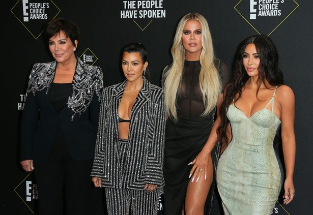Kim poses on the red carpet with mum Kris Jenner and sisters Kourtney and Khloe