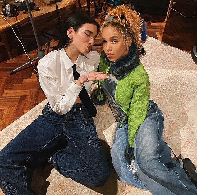 Cycle: Twigs, pictured with singer Dua Lipa, said she filed the lawsuit and was speaking out to show how someone with a large network like herself could be caught up in an abusive cycle