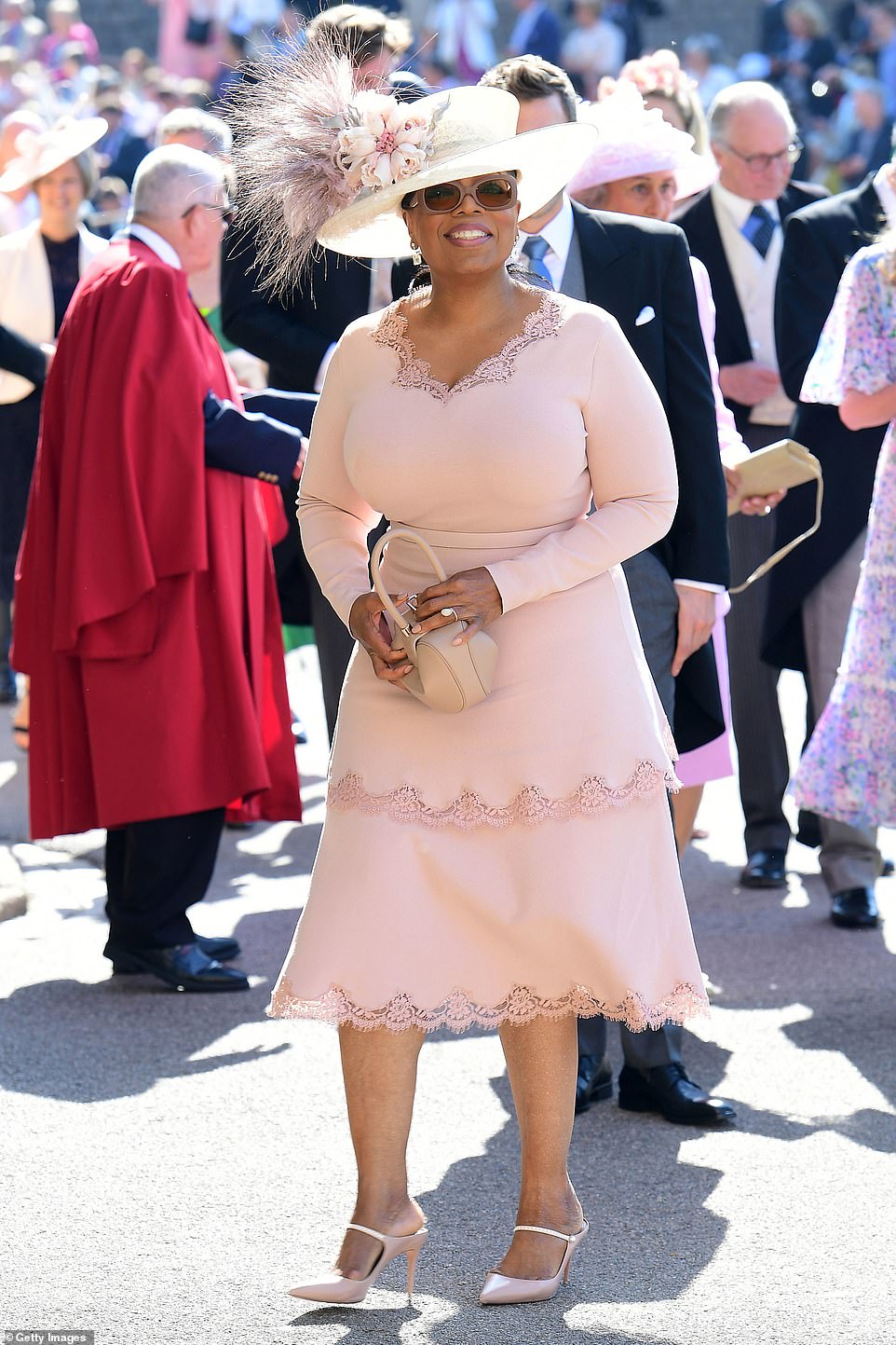 Media mogul Oprah has grown close to both Meghan and Prince Harry, 36, and attended their wedding in May 2018 (pictured)